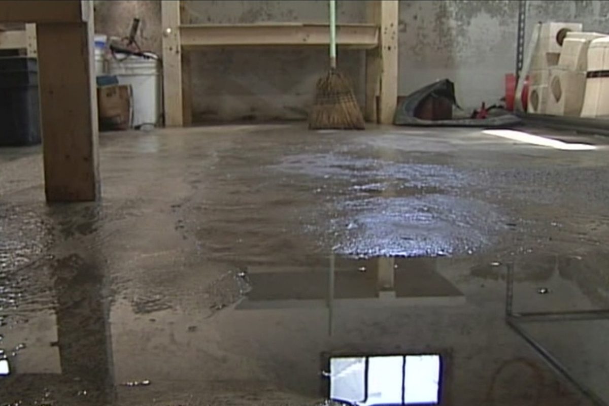 Featured image for Moisture Seeping Through Basement Floor? How to Stop It Permanently
